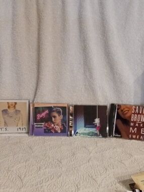 Assorted Music CD Collection - White, Purple, Brown Covers